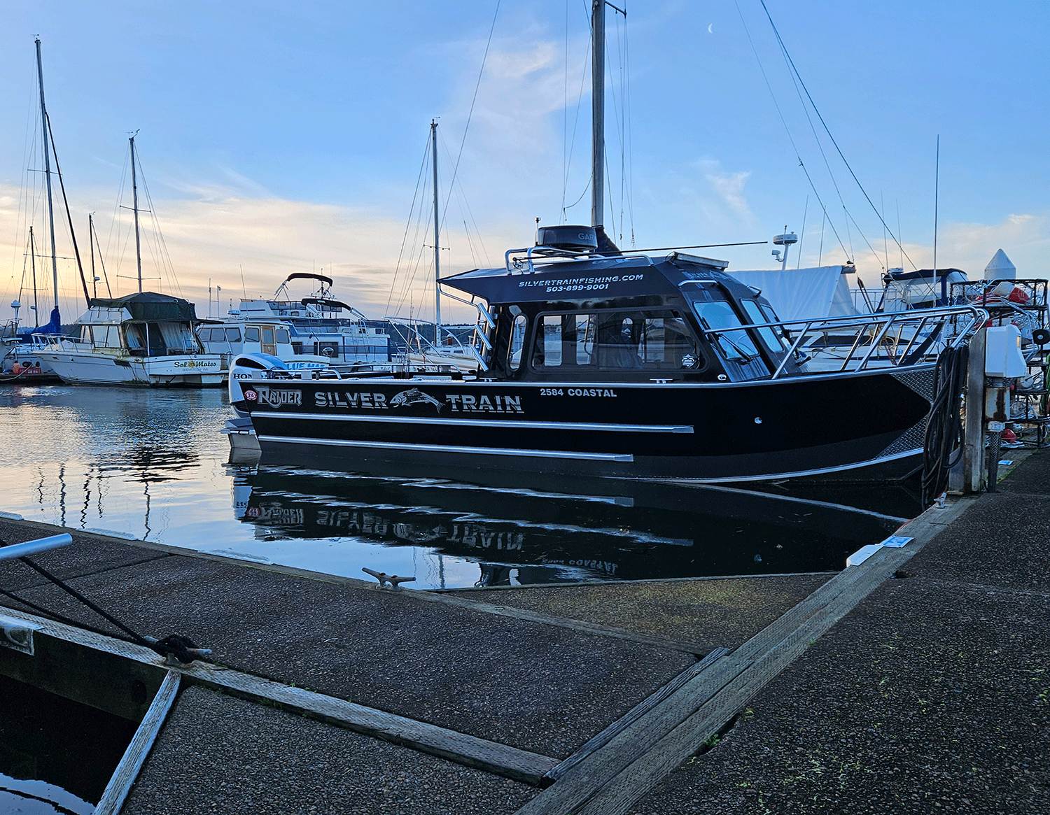 Black fishing boat in dock