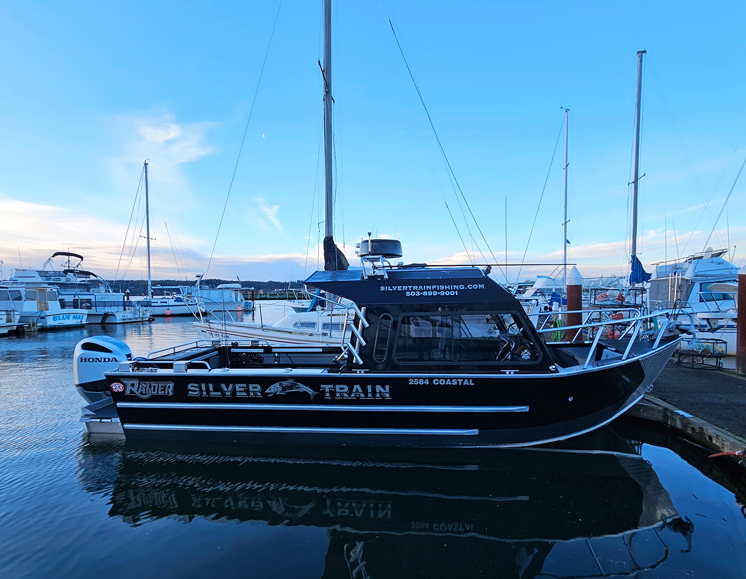 Black fishing boat in dock