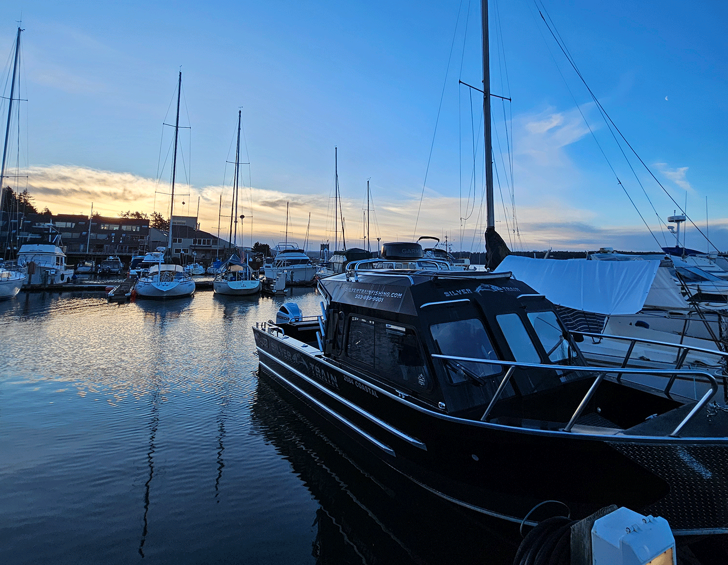 Black fishing boat in dock